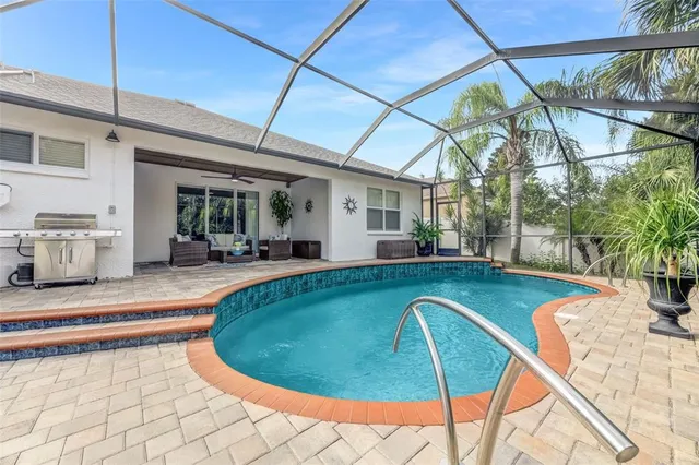an aerial view of a house with a yard and a garage