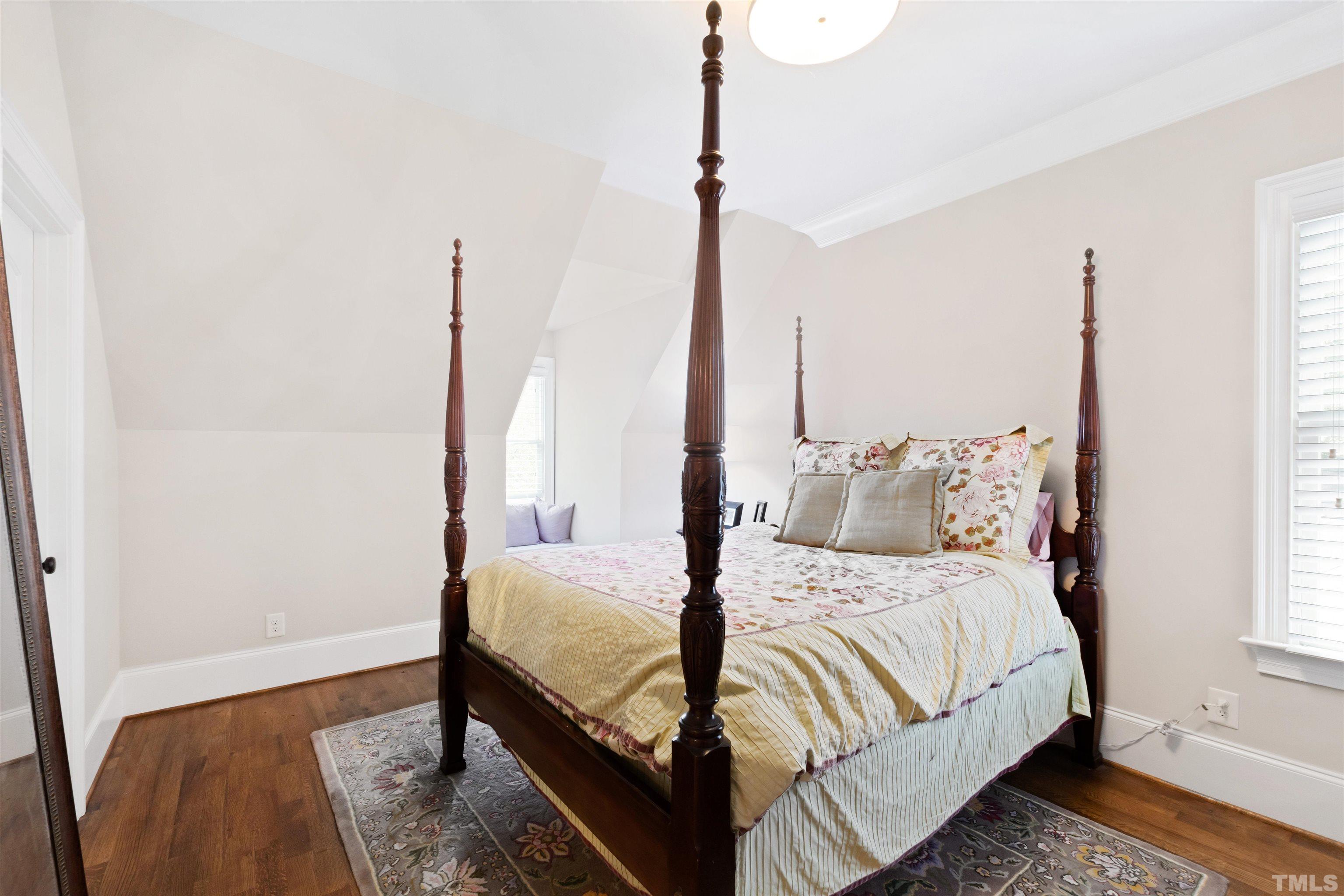 1231 Canterbury Road Raleigh, NC 27608 - Photo 45 of 67 a bedroom with bed and a window