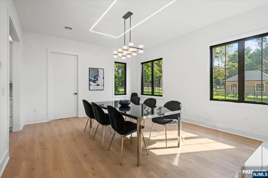 23 Brook Road Upper Saddle River, NJ 07458 - Photo 13 of 27 a view of a dining room with furniture window and outside view