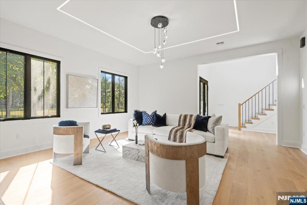 23 Brook Road Upper Saddle River, NJ 07458 - Photo 16 of 27 a living room with furniture and a large window