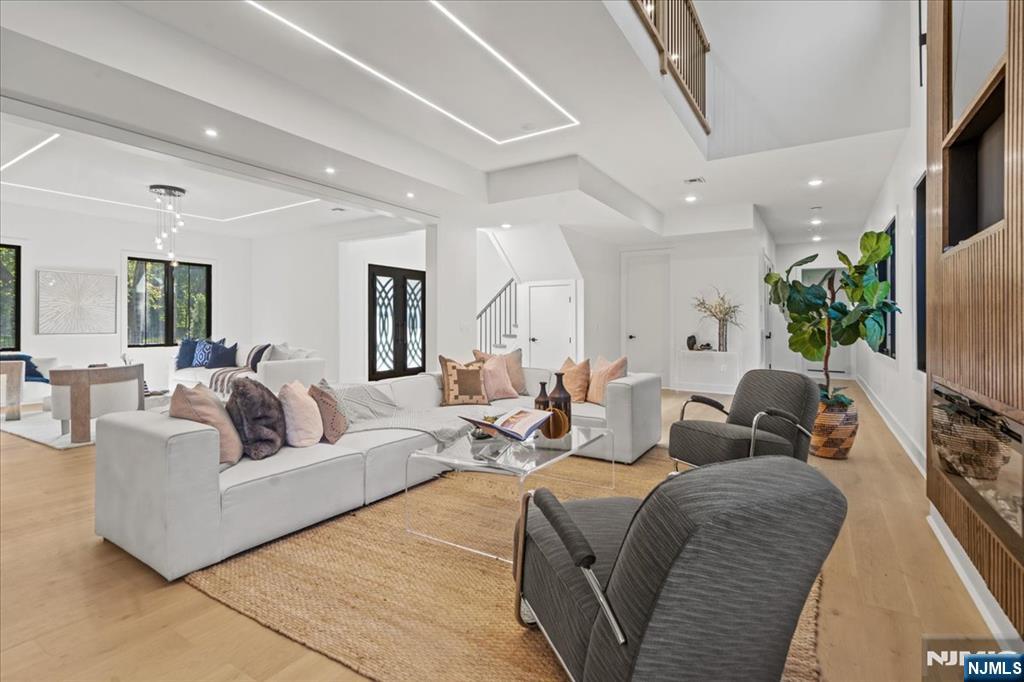 23 Brook Road Upper Saddle River, NJ 07458 - Photo 18 of 27 a living room with furniture or couch and a flat screen tv