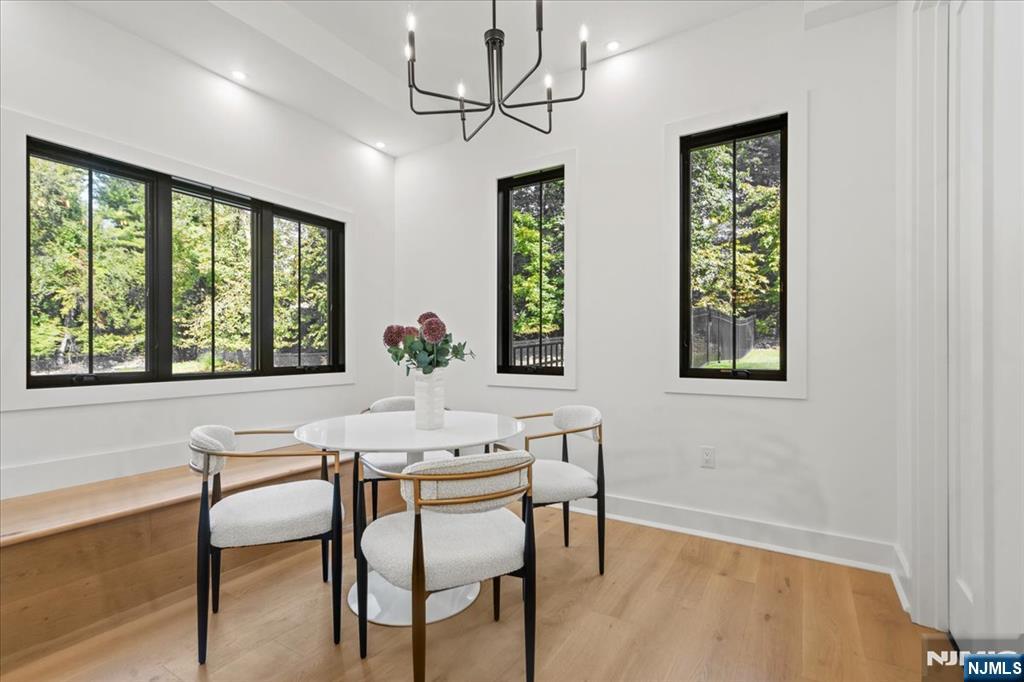 23 Brook Road Upper Saddle River, NJ 07458 - Photo 20 of 27 a view of a dining room with furniture window and outside view
