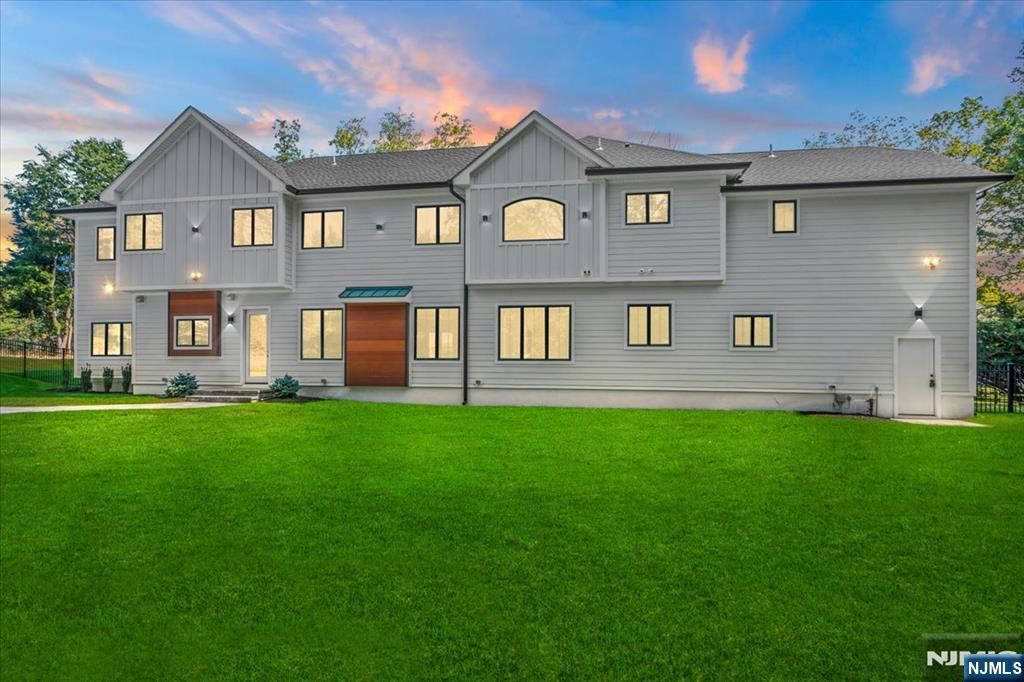 23 Brook Road Upper Saddle River, NJ 07458 - Photo 2 of 27 a front view of a house with a yard