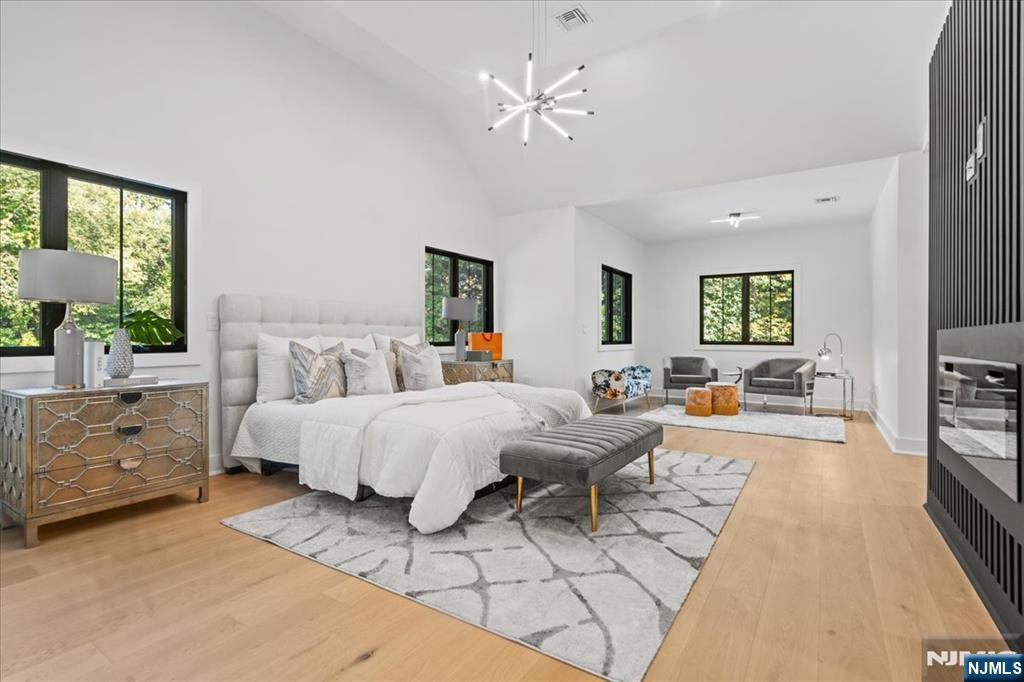 23 Brook Road Upper Saddle River, NJ 07458 - Photo 21 of 27 a spacious bedroom with a bed and a couch