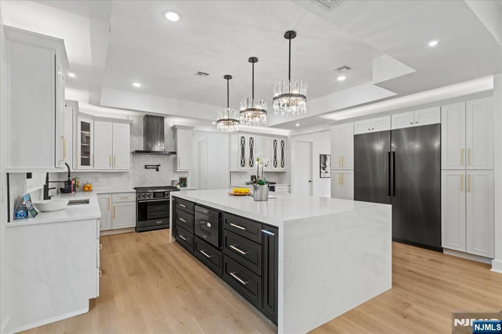 23 Brook Road Upper Saddle River, NJ 07458 - Photo 10 of 27 a large kitchen with stainless steel appliances lots of counter space and a sink