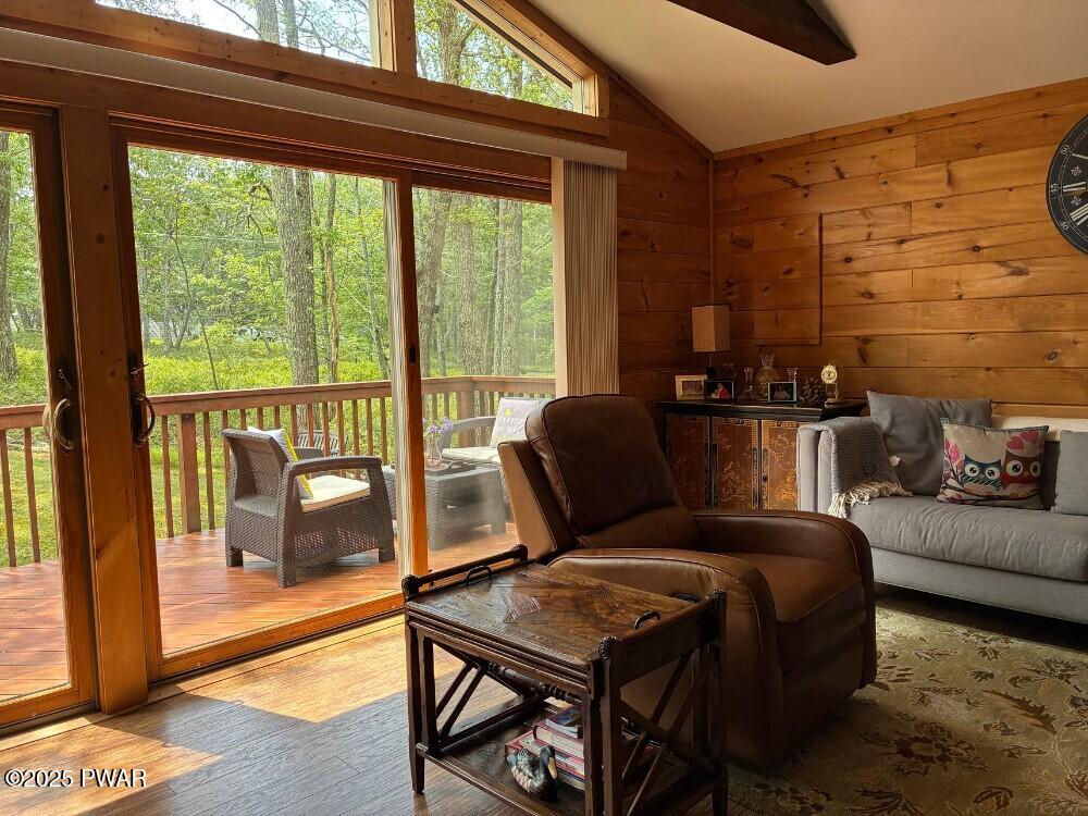 116 Maple Ridge Road Milford, PA 18337 - Photo 7 of 53 a living room with furniture and a floor to ceiling window