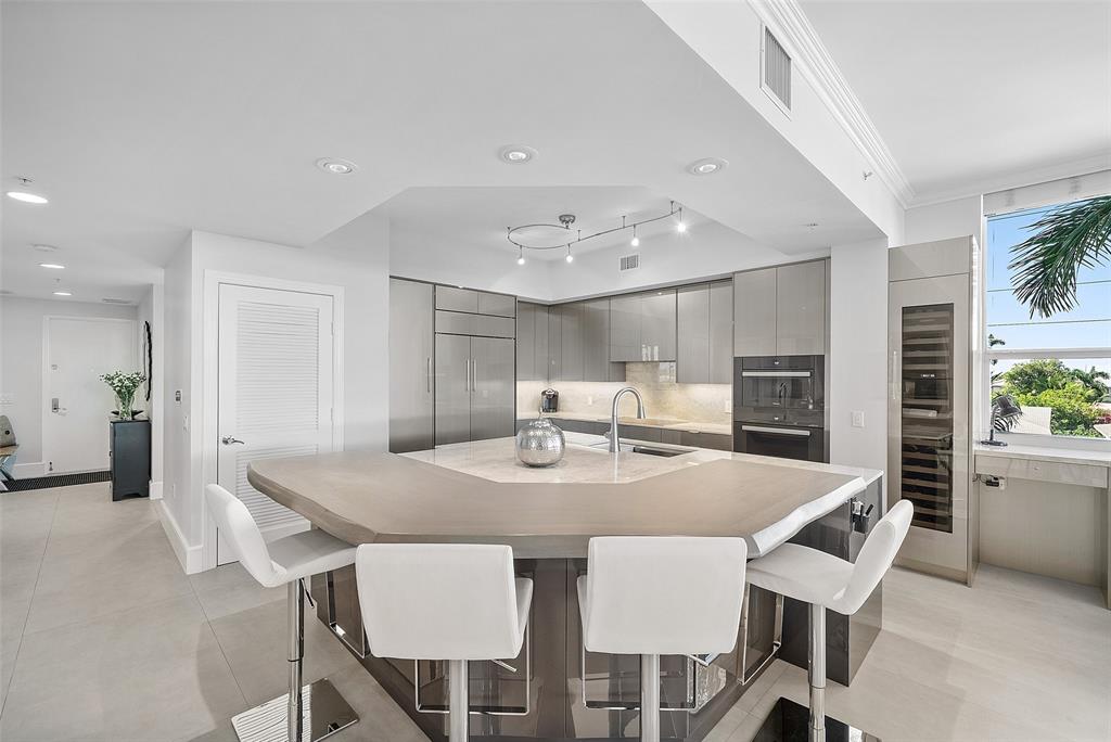 701 Southeast 21st Avenue, Unit 301 Deerfield Beach, FL 33441 - Photo 12 of 63 a view of a dining room with furniture