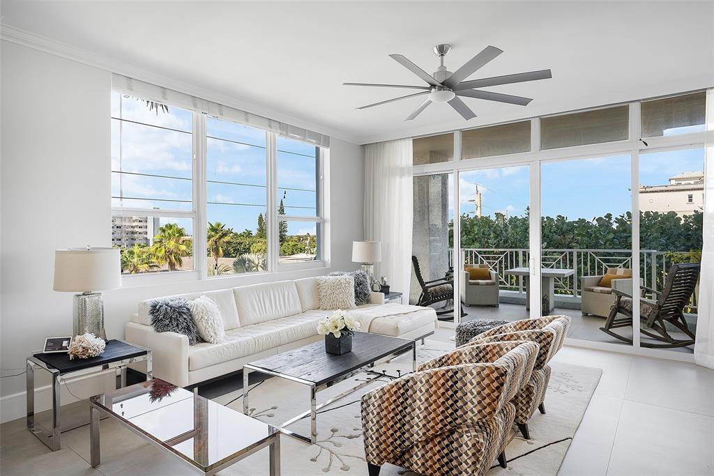 701 Southeast 21st Avenue, Unit 301 Deerfield Beach, FL 33441 - Photo 17 of 63 a living room with furniture and a large window