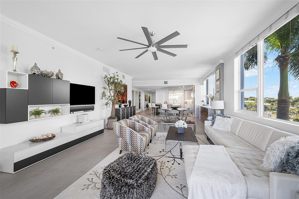 701 Southeast 21st Avenue, Unit 301 Deerfield Beach, FL 33441 - Photo 20 of 63 a living room with furniture and a flat screen tv