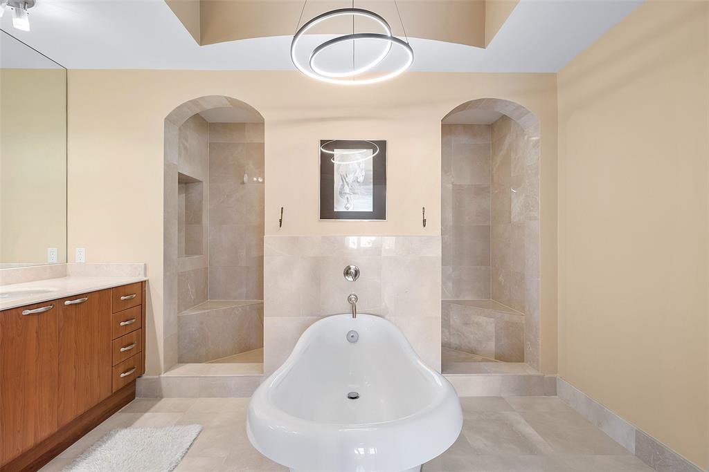 701 Southeast 21st Avenue, Unit 301 Deerfield Beach, FL 33441 - Photo 26 of 63 a bathroom with a sink and mirror