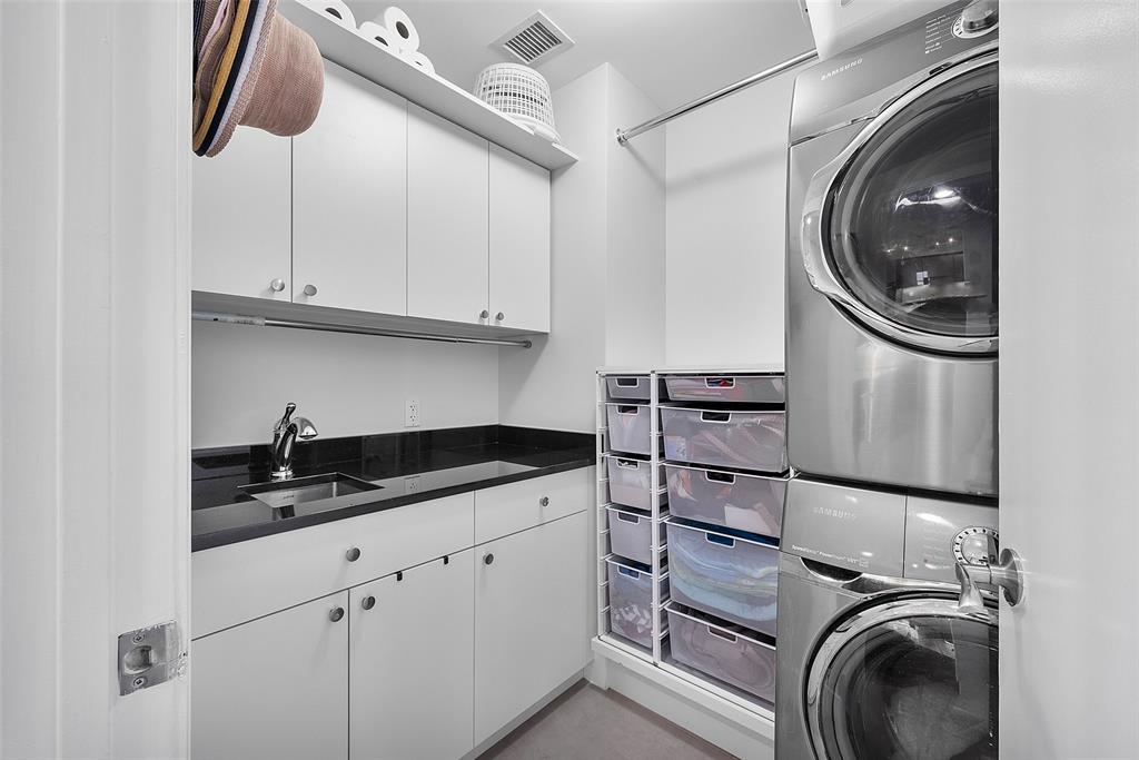 701 Southeast 21st Avenue, Unit 301 Deerfield Beach, FL 33441 - Photo 34 of 63 a kitchen with a sink and cabinets
