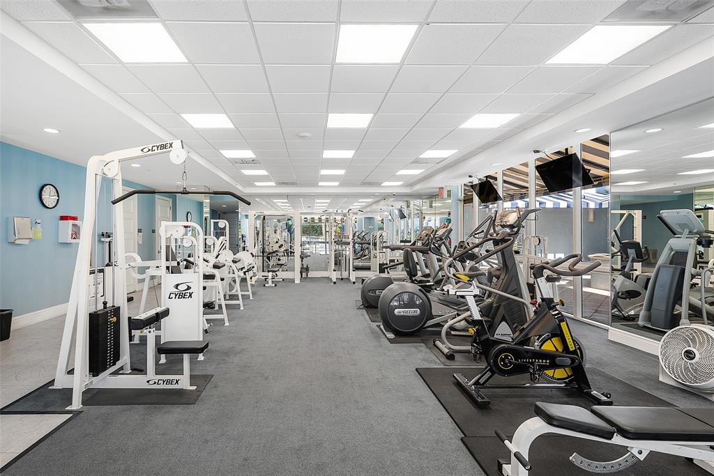 701 Southeast 21st Avenue, Unit 301 Deerfield Beach, FL 33441 - Photo 39 of 63 a view of a room with gym equipment