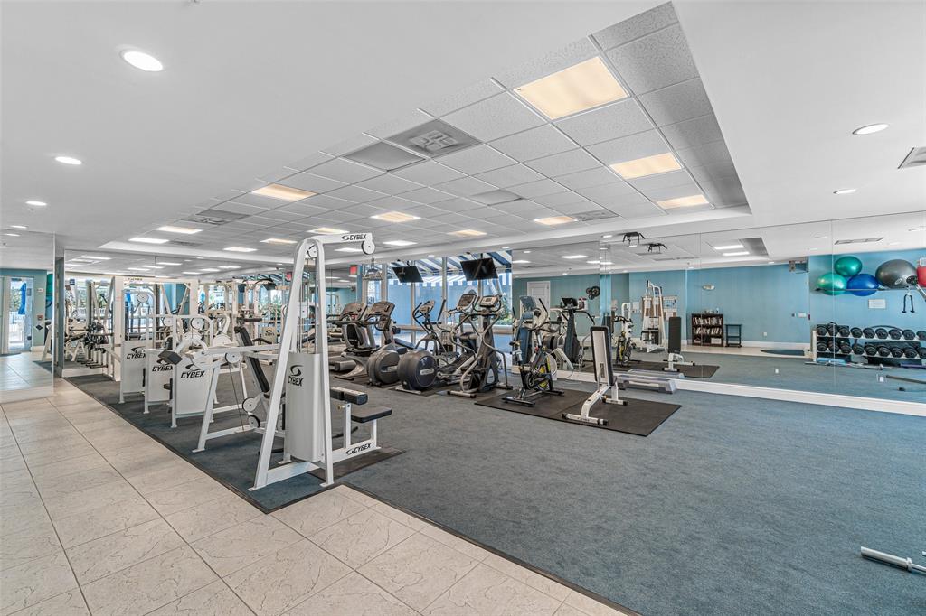 701 Southeast 21st Avenue, Unit 301 Deerfield Beach, FL 33441 - Photo 40 of 63 a view of a room with gym equipment