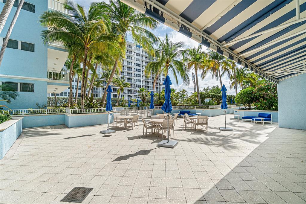 701 Southeast 21st Avenue, Unit 301 Deerfield Beach, FL 33441 - Photo 46 of 63 a view of outdoor space with seating area