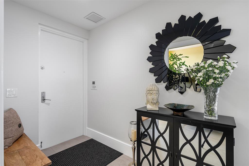 701 Southeast 21st Avenue, Unit 301 Deerfield Beach, FL 33441 - Photo 5 of 63 a vase of flowers sitting on a table