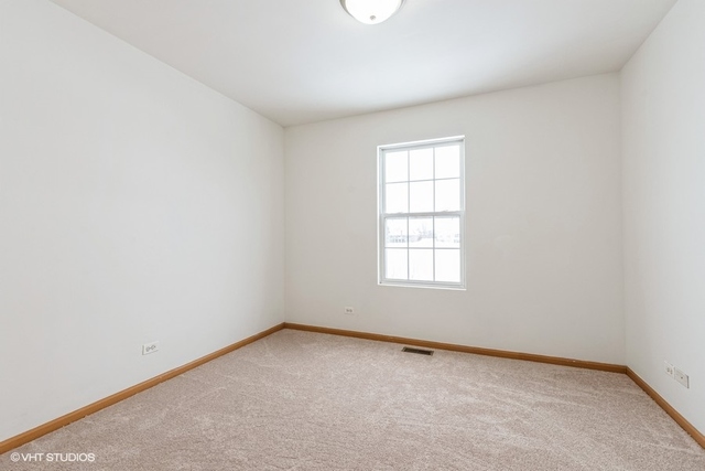 16136 Golf View Drive Lockport, IL 60441 - Photo 11 of 13 an empty room with a window