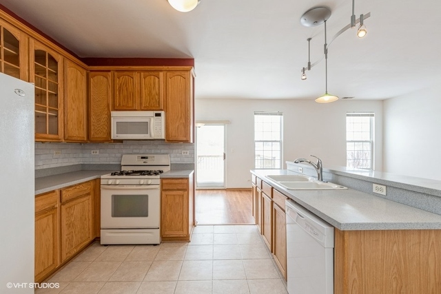 16136 Golf View Drive Lockport, IL 60441 - Photo 4 of 13 a kitchen with a stove sink and microwave