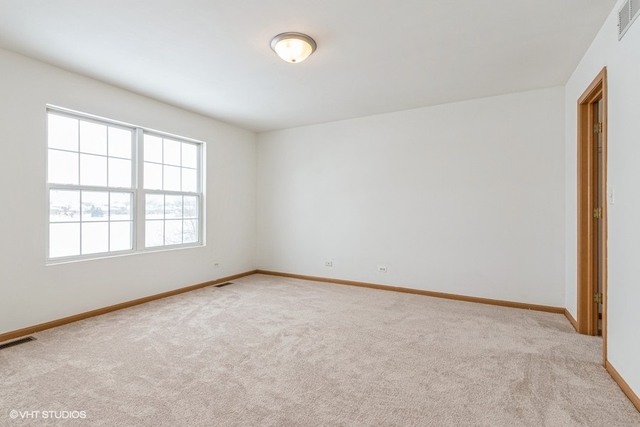 16136 Golf View Drive Lockport, IL 60441 - Photo 7 of 13 an empty room with a window