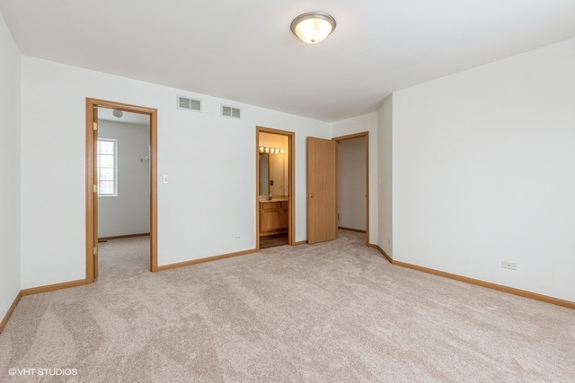 16136 Golf View Drive Lockport, IL 60441 - Photo 8 of 13 an empty room with closet and a bathroom