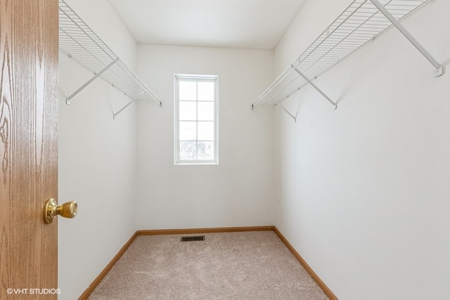 16136 Golf View Drive Lockport, IL 60441 - Photo 9 of 13 an empty room with windows