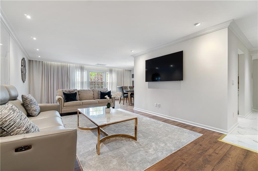 5825 Fifth Avenue, Unit 313 Pittsburgh, PA 15232 - Photo 8 of 24 a living room with furniture and a flat screen tv