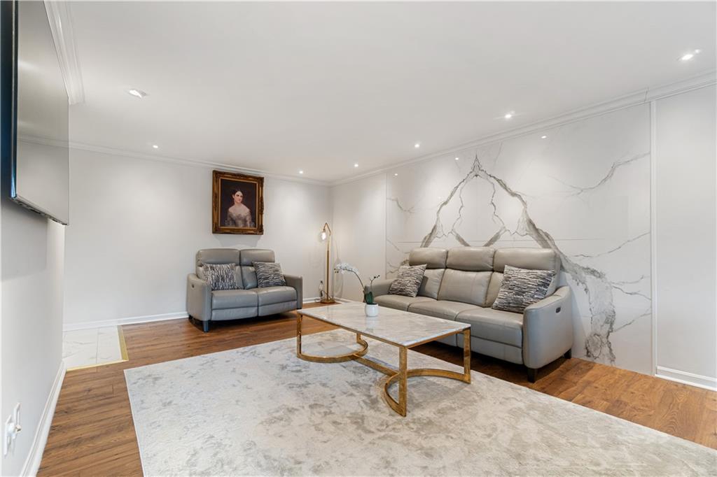 5825 Fifth Avenue, Unit 313 Pittsburgh, PA 15232 - Photo 10 of 24 a living room with furniture and a rug