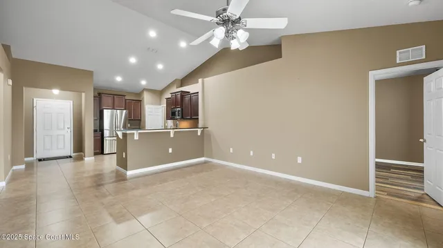 a view of a livingroom with a kitchen