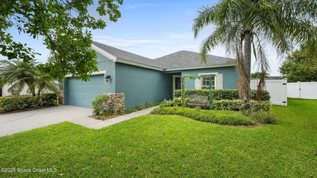 a view of a backyard with a garden