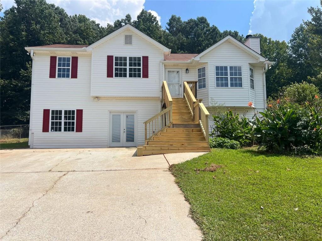 a view of house with garden