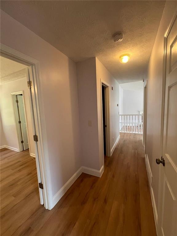 89 Farm Brook Lane Dallas, GA 30157 - Photo 11 of 42 a view of a hallway with wooden floor