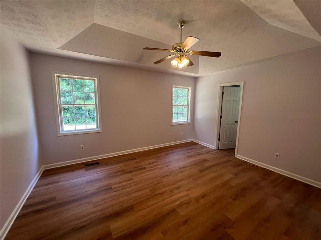 89 Farm Brook Lane Dallas, GA 30157 - Photo 12 of 42 a view of an empty room with window and wooden floor