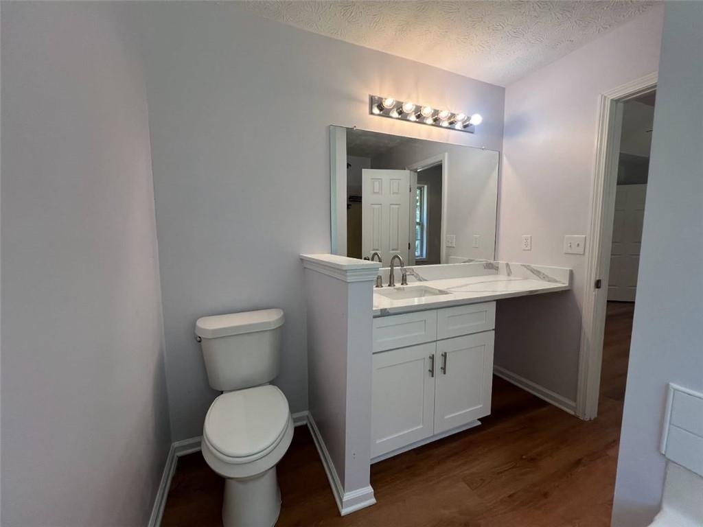 89 Farm Brook Lane Dallas, GA 30157 - Photo 16 of 42 a bathroom with a toilet sink and mirror