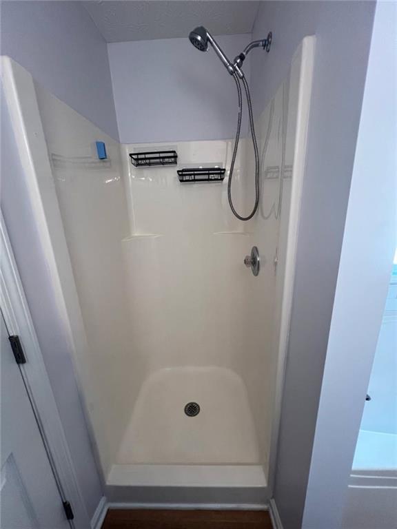 89 Farm Brook Lane Dallas, GA 30157 - Photo 17 of 42 a bathroom with a glass shower door