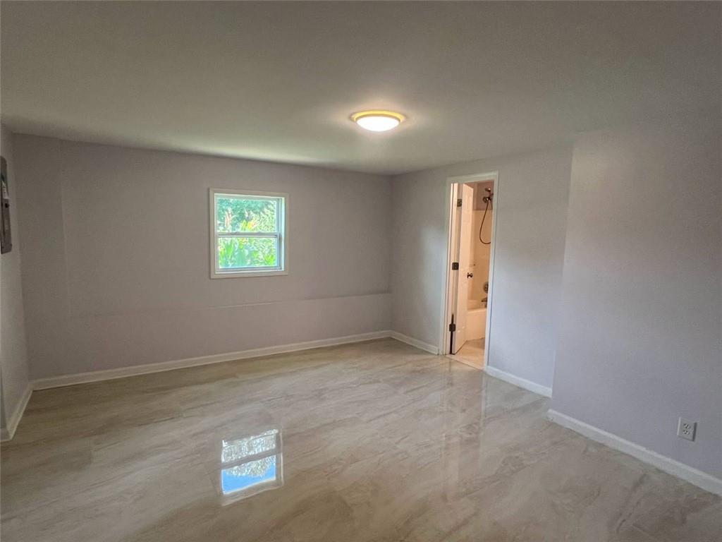 89 Farm Brook Lane Dallas, GA 30157 - Photo 27 of 42 an empty room with windows and closet