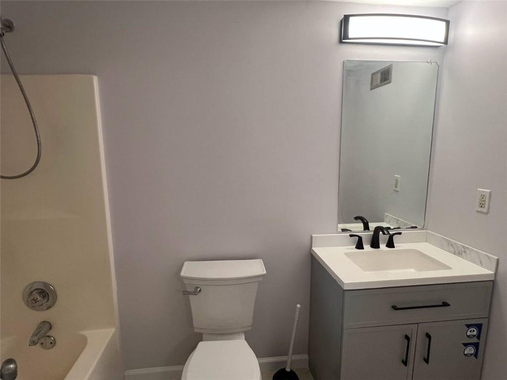 89 Farm Brook Lane Dallas, GA 30157 - Photo 29 of 42 a bathroom with a sink mirror and toilet