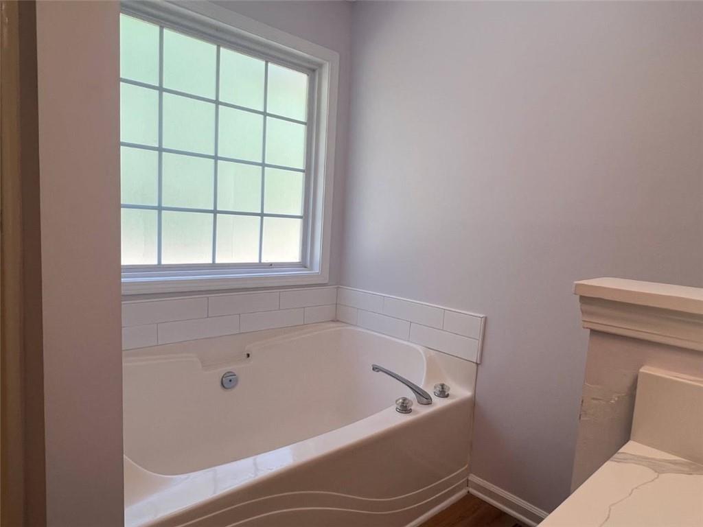 89 Farm Brook Lane Dallas, GA 30157 - Photo 42 of 42 a bath tub sitting next to a window