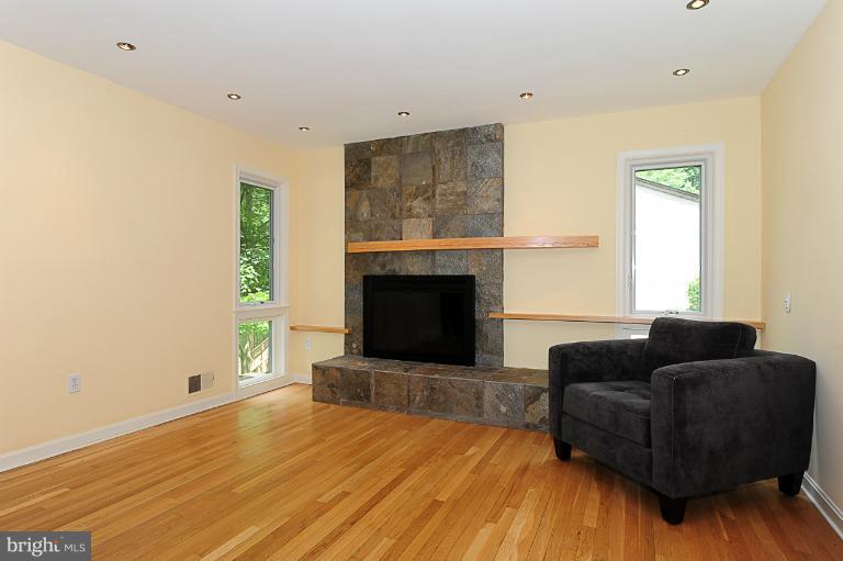 1938 Rockingham Street McLean, VA 22101 - Photo 2 of 4 a living room with furniture and a fireplace