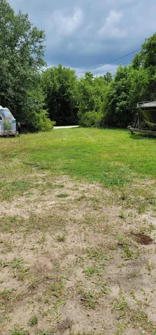 a view of a garden with a building in the background