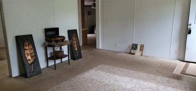 a view of room with workspace and windows