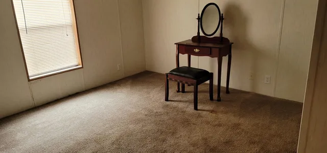 a room with a table and a potted plant