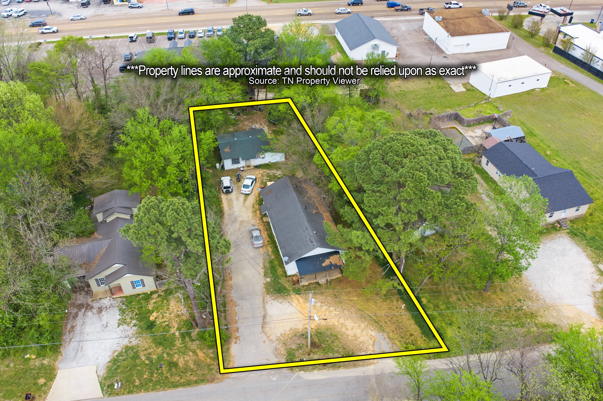 252 North Main Street Lexington, TN 38351 - Photo 4 of 11 an aerial view of a house with a lake view