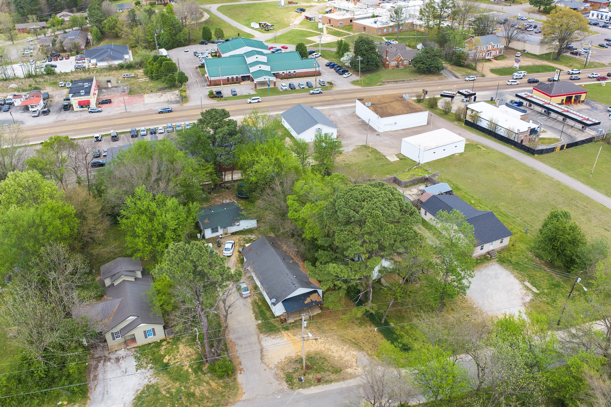 252 North Main Street Lexington, TN 38351 - Photo 7 of 11 an aerial view of residential houses with outdoor space and swimming pool