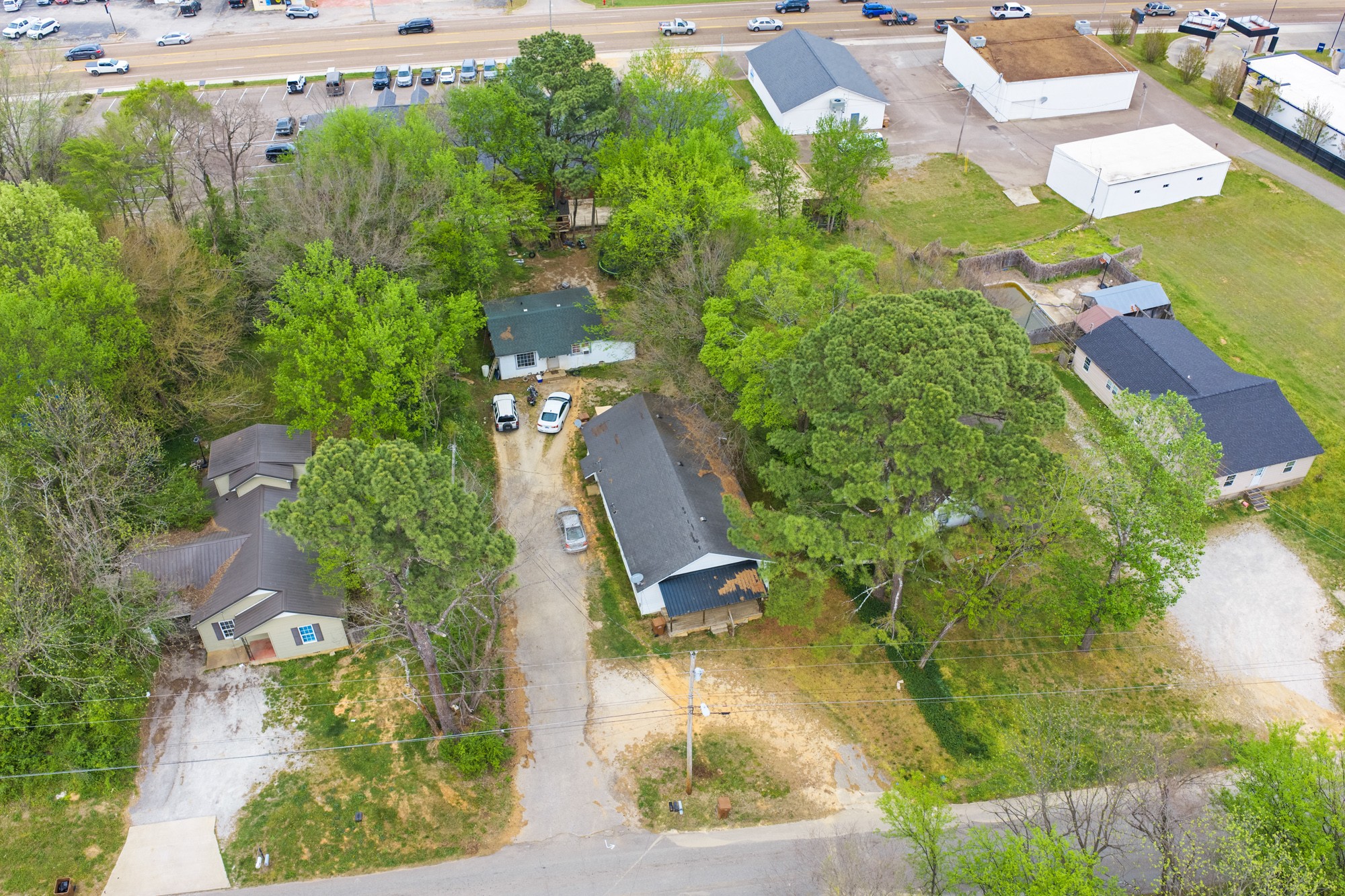 252 North Main Street Lexington, TN 38351 - Photo 8 of 11 an aerial view of a house with a yard and lake view