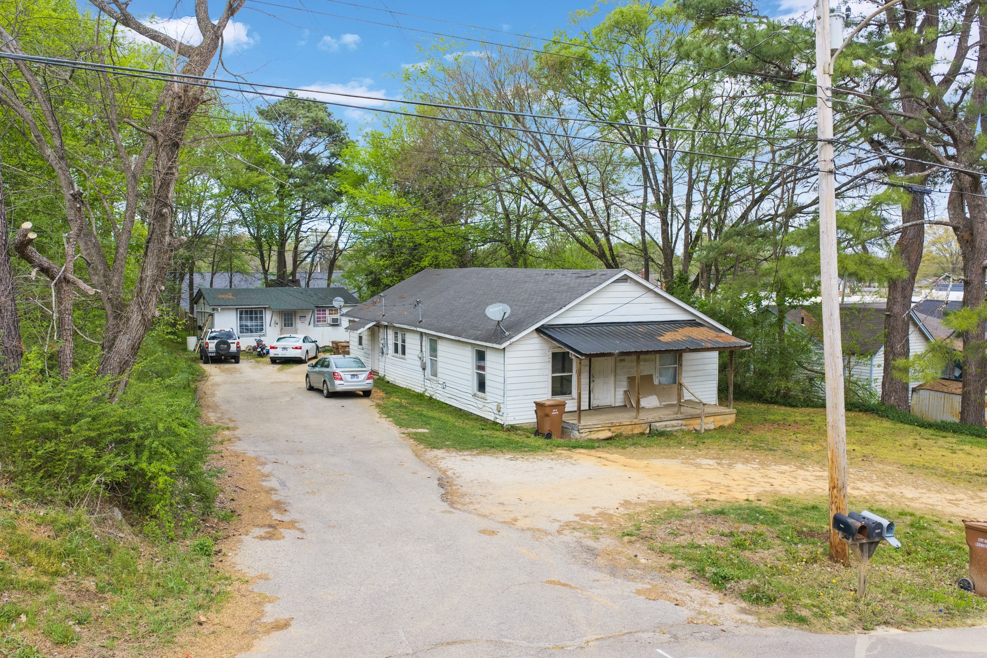 252 North Main Street Lexington, TN 38351 - Photo 10 of 11 a view of a house with a big yard and large trees