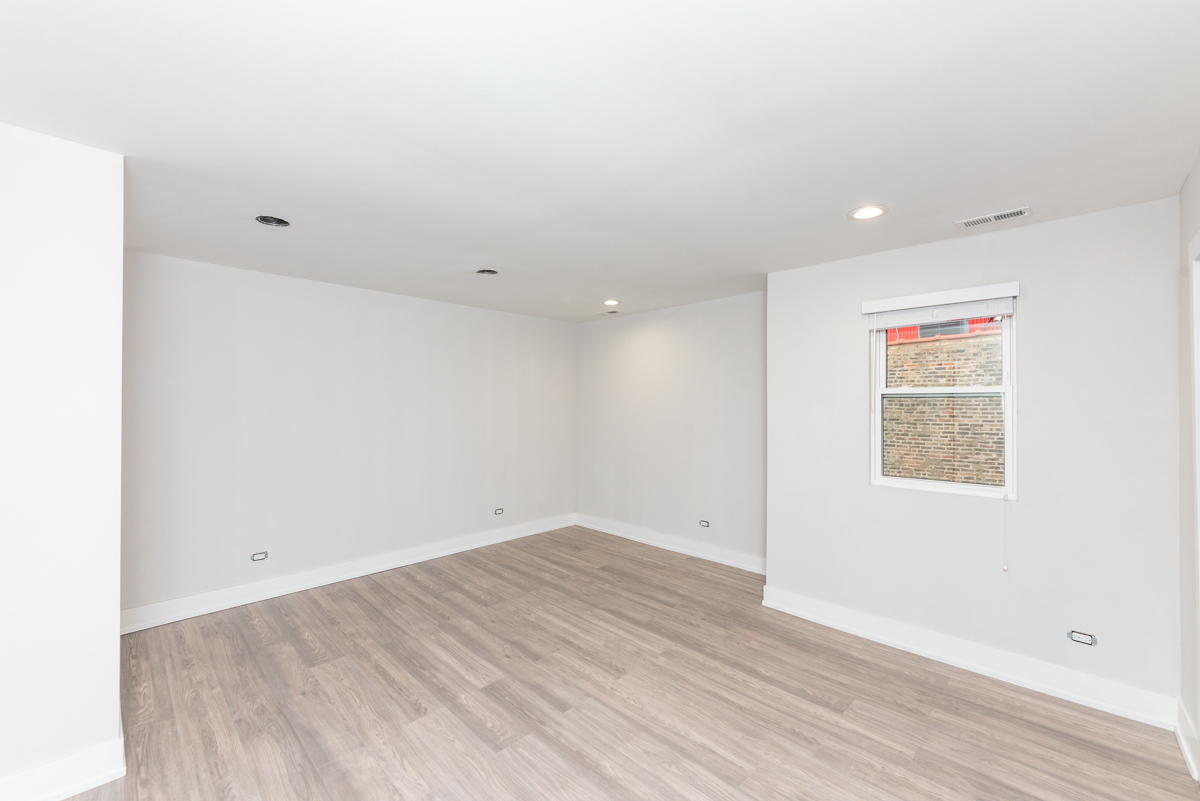 1907 South Racine Avenue, Unit 4F Chicago, IL 60608 - Photo 13 of 18 an empty room with wooden floor
