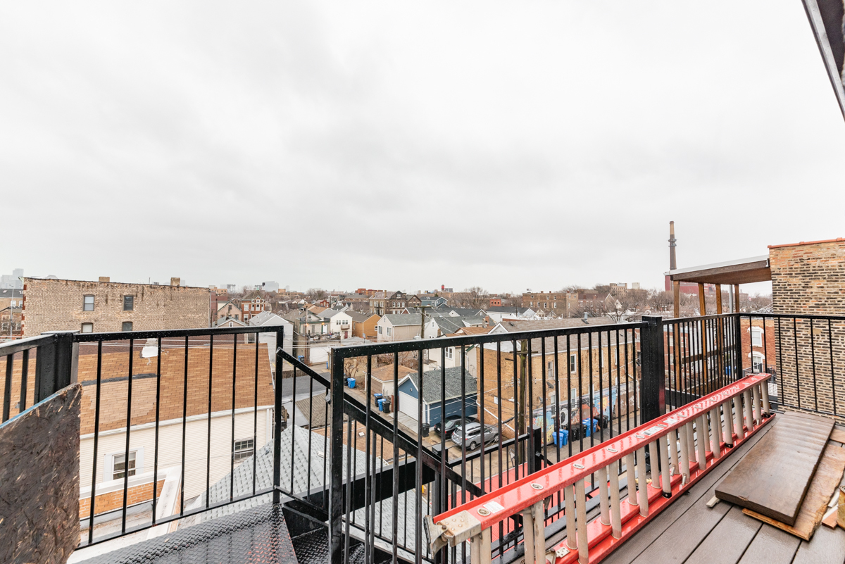 1907 South Racine Avenue, Unit 4F Chicago, IL 60608 - Photo 18 of 18 a view of a balcony with wooden floor