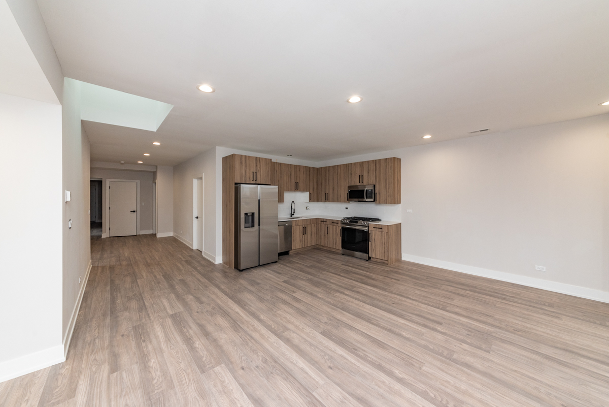 1907 South Racine Avenue, Unit 4F Chicago, IL 60608 - Photo 4 of 18 a view of kitchen with stainless steel appliances a refrigerator and a stove top oven