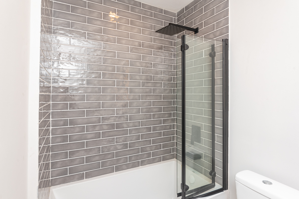 1907 South Racine Avenue, Unit 4F Chicago, IL 60608 - Photo 6 of 18 a bathroom with a shower and toilet