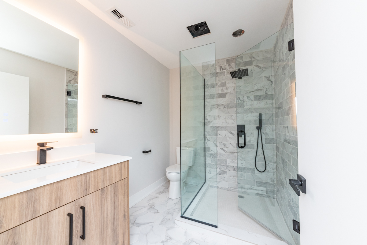 1907 South Racine Avenue, Unit 4F Chicago, IL 60608 - Photo 7 of 18 a bathroom with a shower sink and mirror