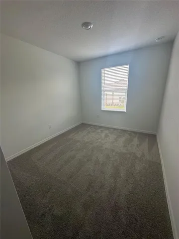 a bathroom with a sink and mirror with toilet